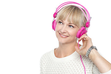 Image showing Gorgeous woman listening to music