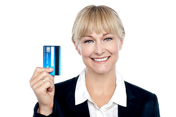 Image showing Joyous female employee showing credit card