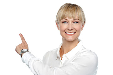 Image showing Corporate lady pointing backwards