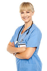 Image showing Happy and confident doctor posing arms crossed