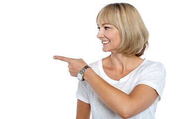Image showing Woman in casuals pointing sideways