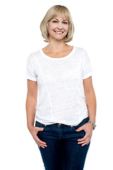 Image showing Middle aged woman in trendy clothing smiling at you