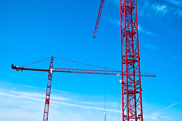 Image showing Red tower construction cranes