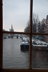 Image showing Amsterdam in snow through window