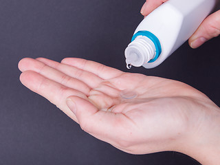 Image showing Woman holds a Contact Lens