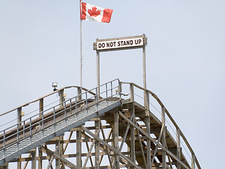 Image showing Do not stand up on the roller coaster