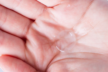 Image showing Woman holds a Contact Lens