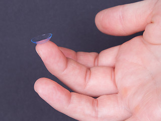 Image showing Woman holds a Contact Lens