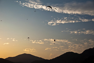 Image showing Paragliders in sunset in Turkey