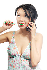 Image showing Phone call and toothbrushing