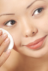 Image showing Woman and skin cleaner