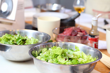 Image showing Green salad leaves are on a kitchen
