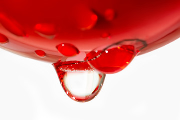 Image showing Water drop from red sphere