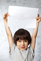 Image showing enthusiastic boy  with  placard