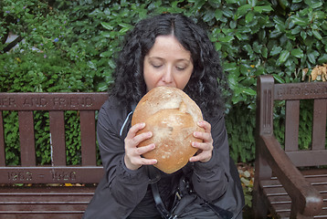 Image showing Girl eating bread