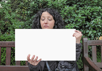 Image showing Girl holding banner