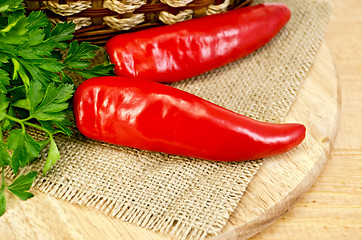 Image showing Peppers on a wooden board