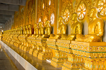 Image showing row of golden monk buddhist statues in thai temple, Chaimongkhol