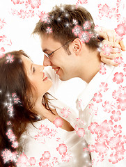 Image showing sweet couple with red flowers