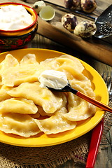 Image showing Dumplings with cottage cheese and sour cream.