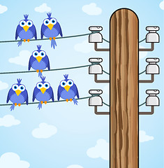 Image showing Bird sitting on a high-voltage wires