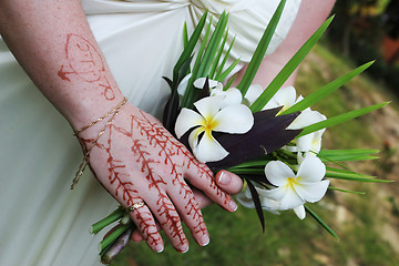 Image showing Henna hand design and bouquet
