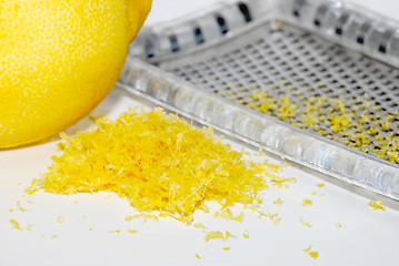 Image showing Grated lemon zest with the fruit and grater