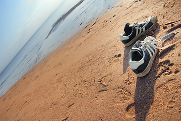 Image showing Shoes of beach the traveller