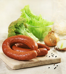 Image showing smoked sausages and vegetables