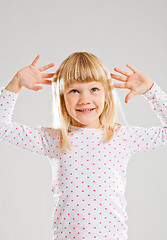 Image showing Happy young girl looking up