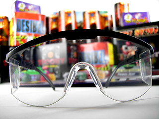 Image showing Safety goggles and firework