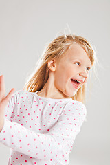 Image showing Happy smiling young girl looking to side