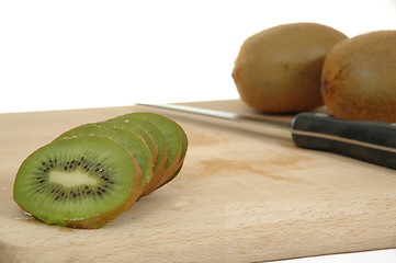 Image showing Kiwi slices with knife