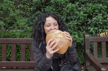 Image showing Girl eating bread