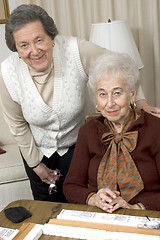 Image showing senior woman at the game table