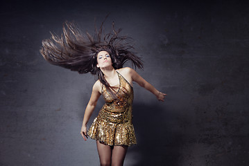 Image showing Disco dancer with long hairs