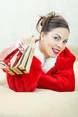 Image showing Female Santa with gift