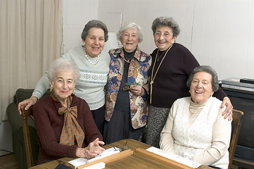 Image showing senior woman at the game table