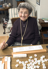 Image showing senior woman at the game table