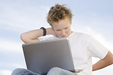 Image showing Handsome boy rest with mobile computer