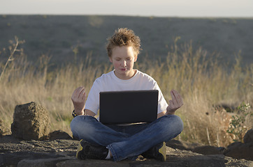 Image showing Meditation in nature at sunset