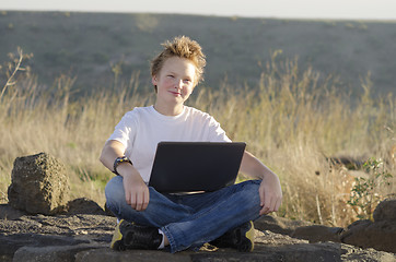 Image showing Teen male with notebook