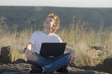 Image showing Handsome kid look at the sky