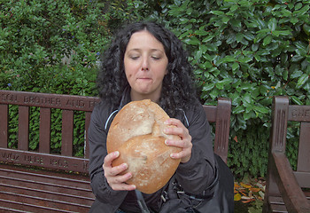 Image showing Girl eating bread