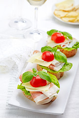 Image showing Sandwich with prosciutto, parmesan cheese and tomato