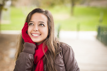 Image showing Pretty Woman Portrait Wearing Red Scarf and Mittens Outside