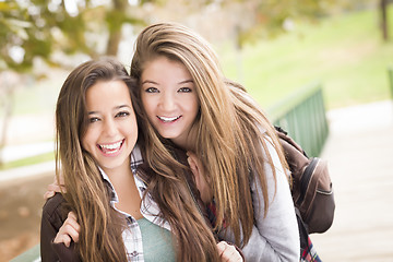 Image showing Mixed Race Women Pose for a Portrait Outside