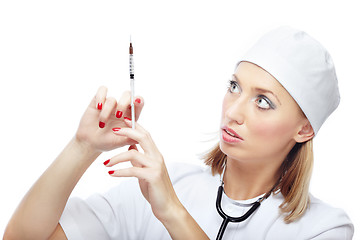 Image showing Doctor with single-use syringe