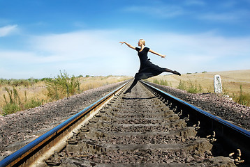 Image showing Walking through the railway