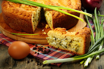 Image showing Pie stuffed with eggs and onion closeup.